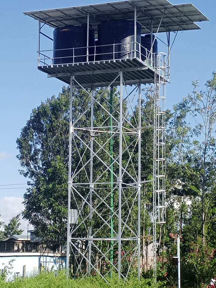 A community gathering around a newly installed water well.